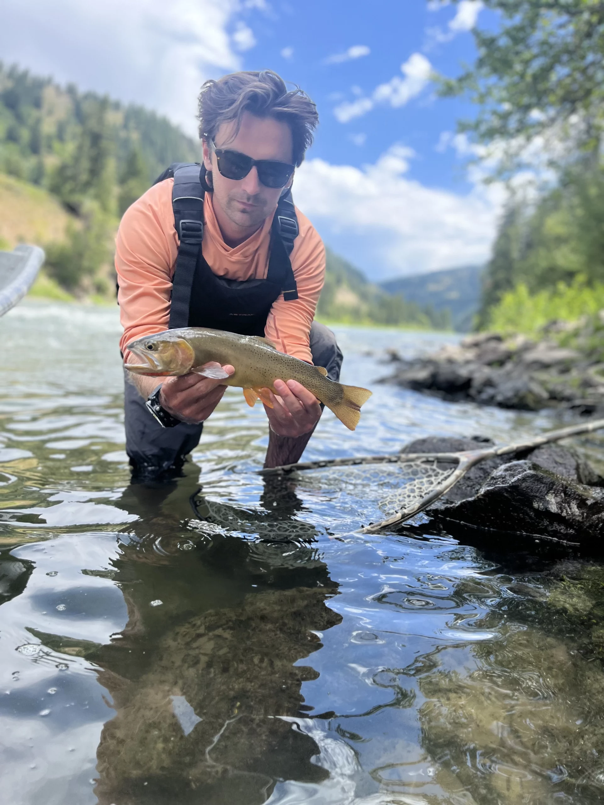 A Teton Troutfitters guide reading the Snake River